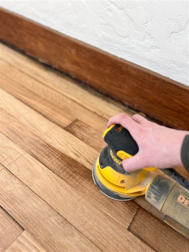 Do you have to take off baseboards to refinish hardwood floors